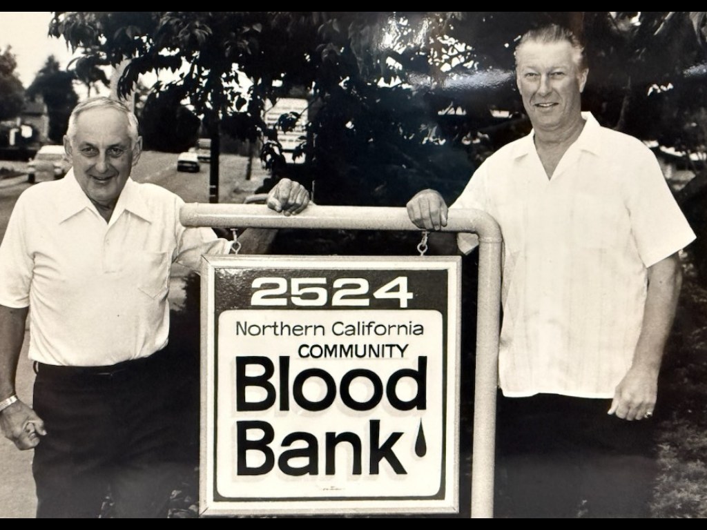 Two early Northern California Community Blood Bank leaders beside the 2524 Harrison Avenue sign